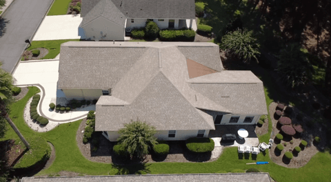 The same style of asphalt roof after rejuvenation, darker and more even